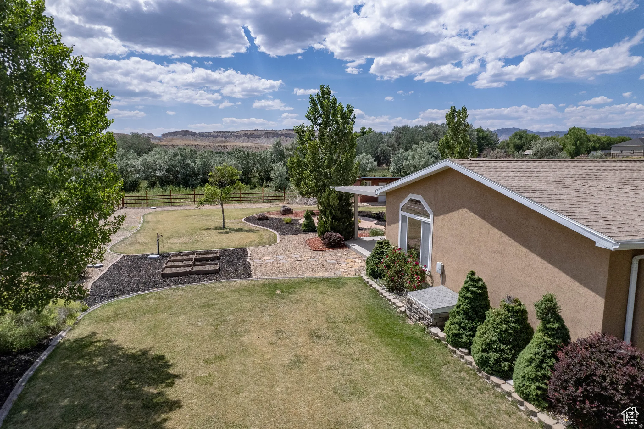 Fenced yard with a mountain view