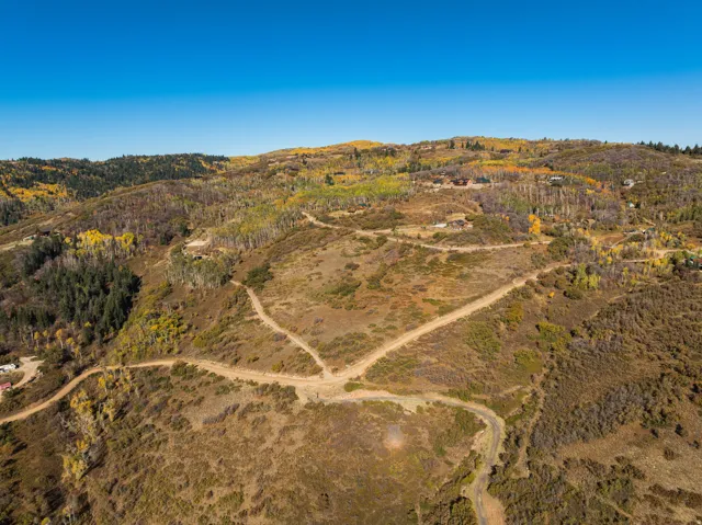 Aerial view of sparsely populated area featuring a mountain backdrop