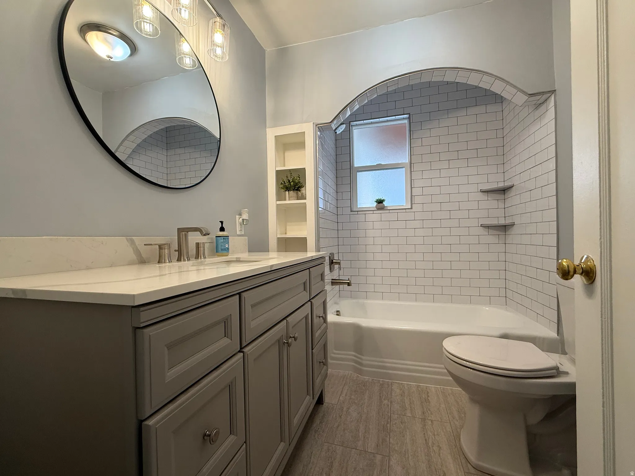 Bathroom with vanity and shower / bathtub combination