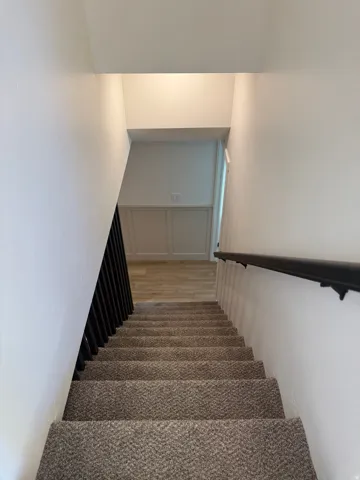 Stairway with wood finished floors