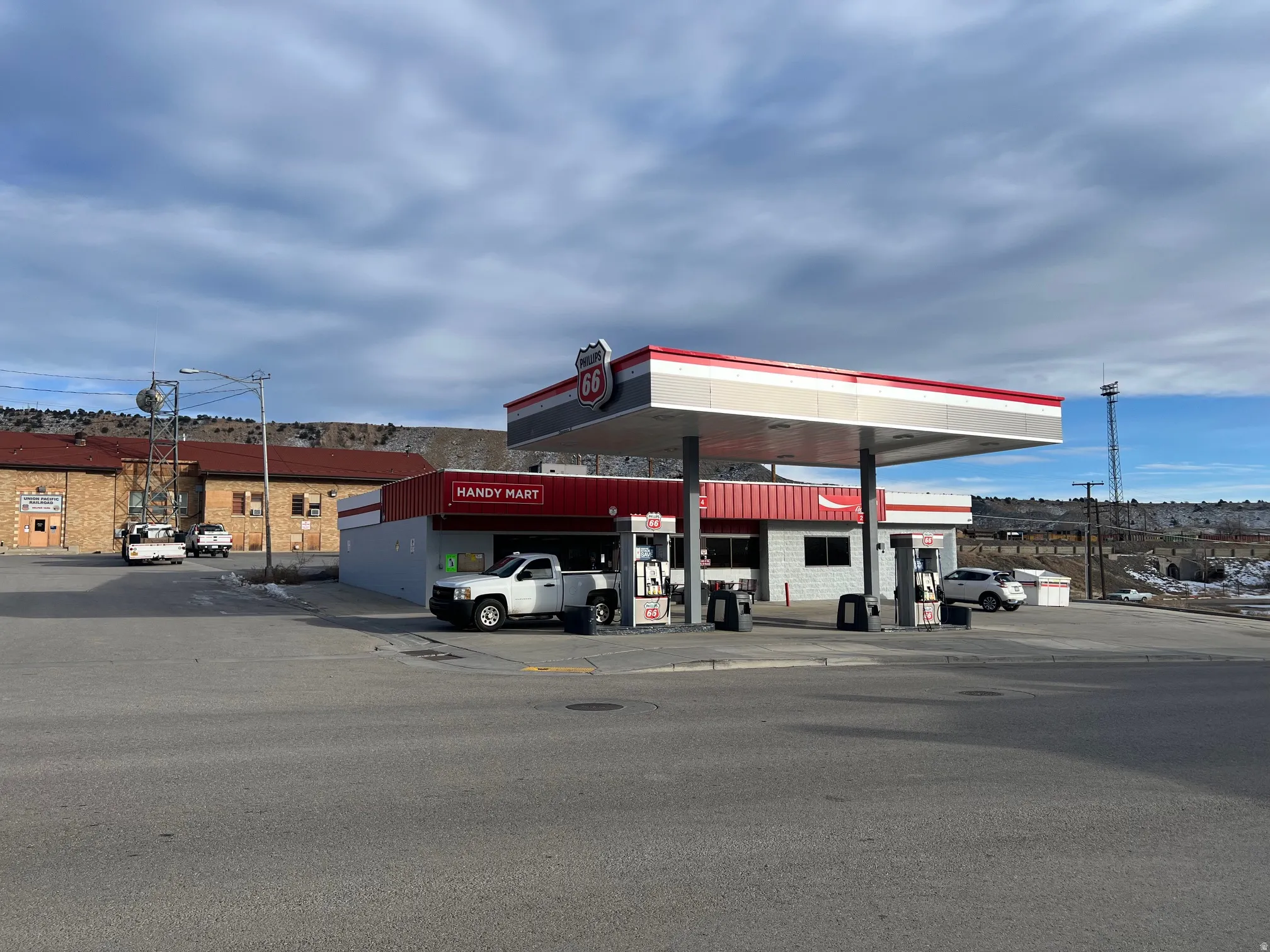 View of commercial property with uncovered parking