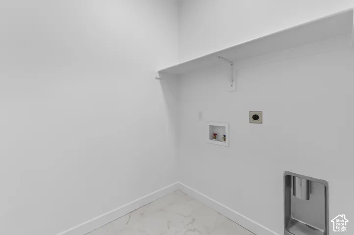 White wall paneling with a built-in shelving unit and tile flooring