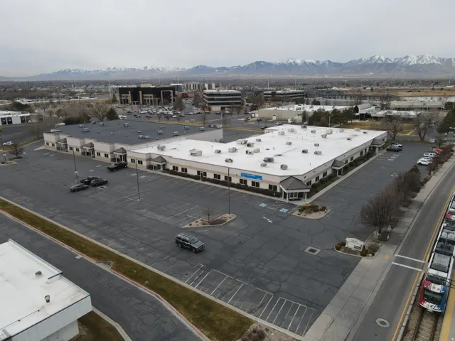 Bird's eye view of a mountain backdrop and a commercial area