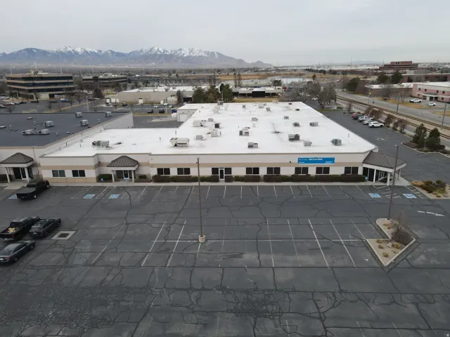 Aerial view of a mountainous background and a commercial area
