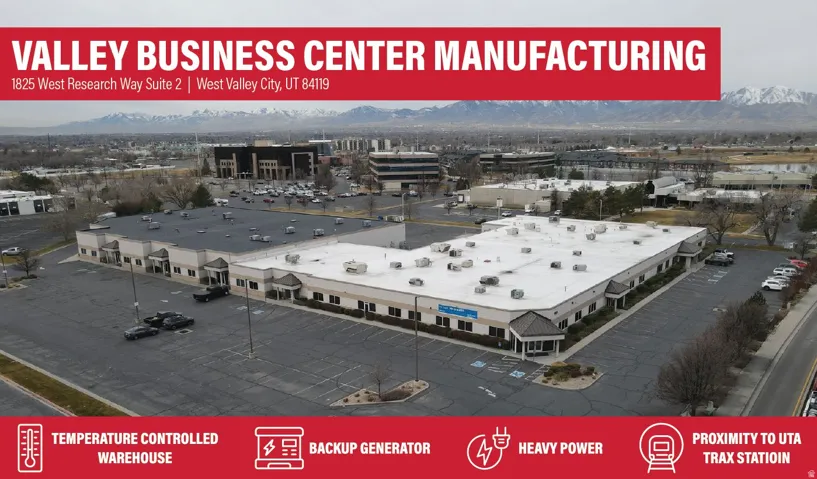 Bird's eye view of mountains and a commercial area