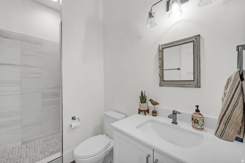 Full bathroom featuring vanity and walk in shower