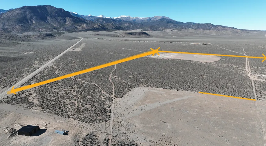 Bird's eye view of a mountainous background and a desert landscape