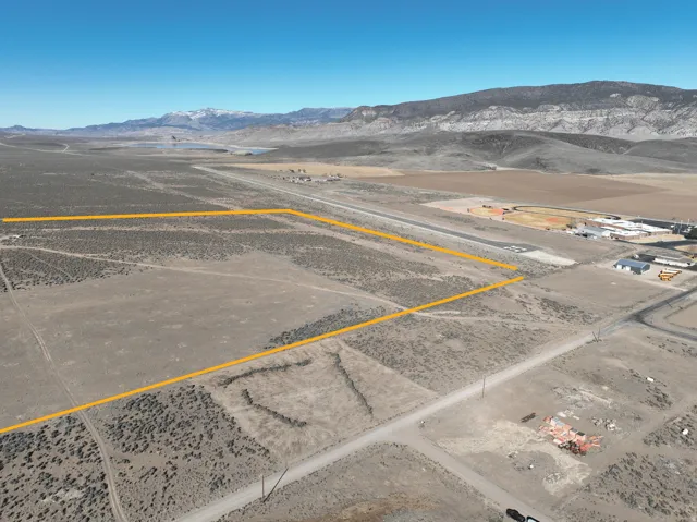 View of rural area with a mountain backdrop and property parcel outlined
