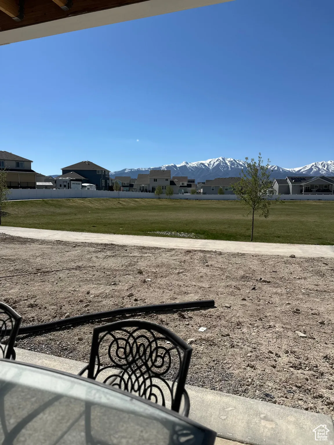 View of green lawn with a mountain view