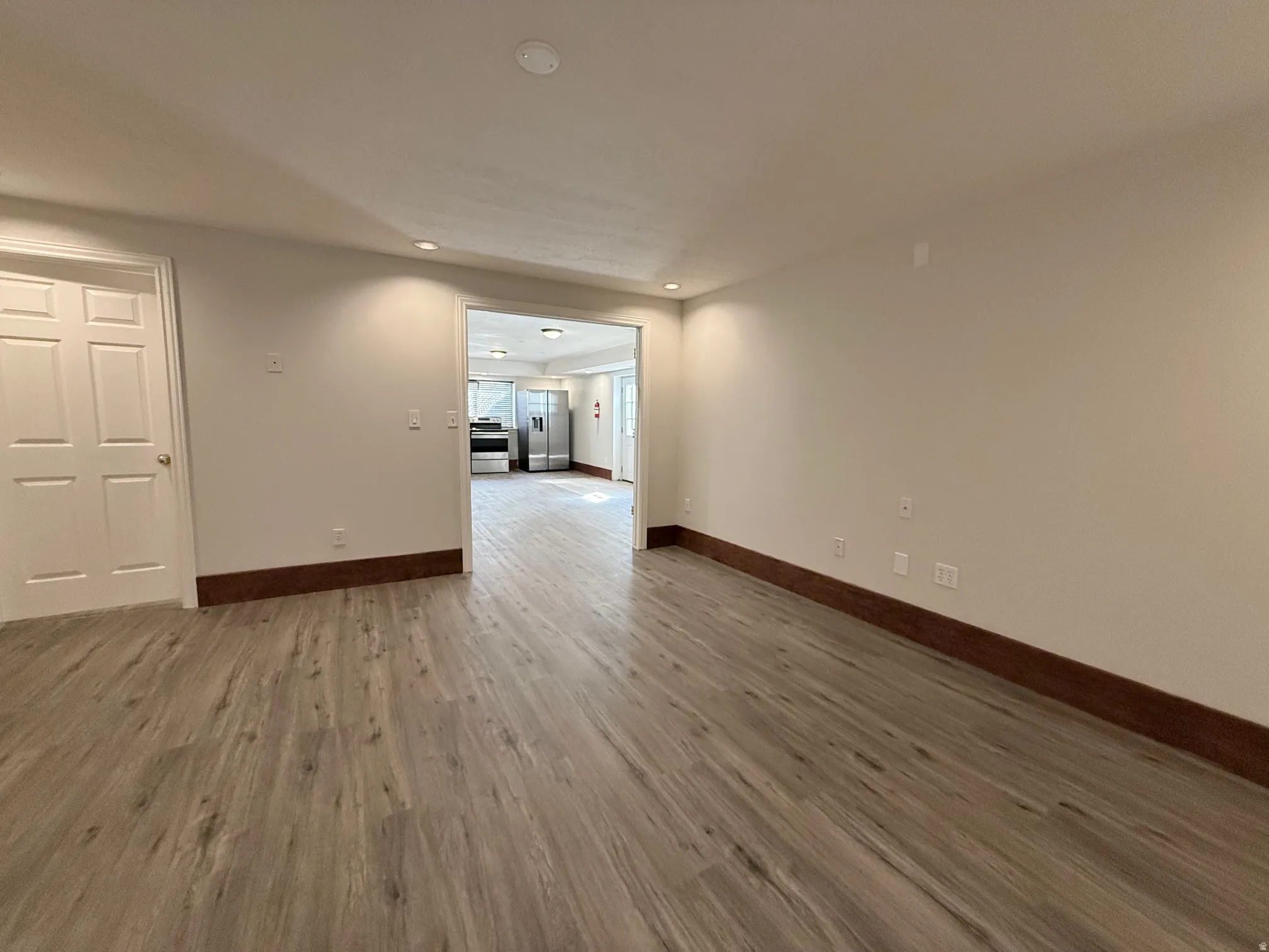 Unfurnished room featuring light wood-type flooring and recessed lighting