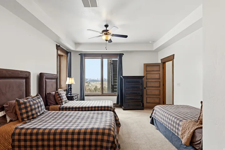 Bedroom featuring carpet flooring and ceiling fan