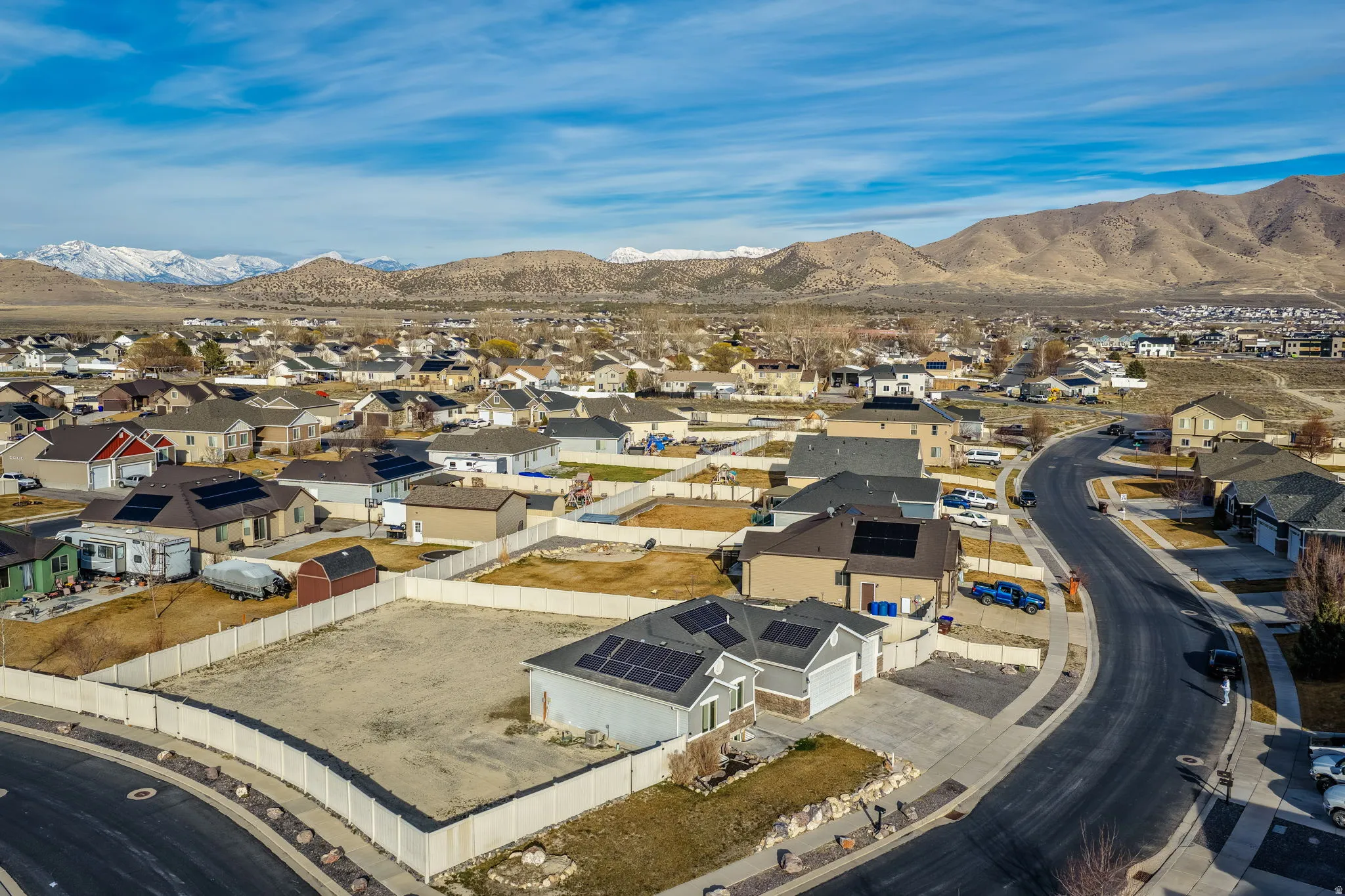 Aerial view of residential area featuring a mountain backdrop