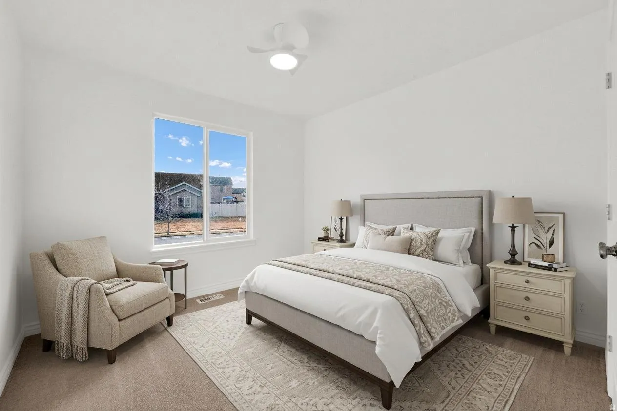 Staged Bedroom featuring baseboards and ceiling fan