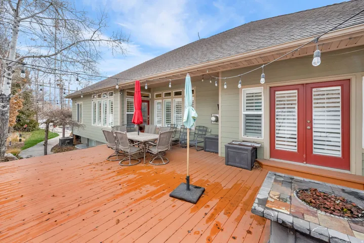 Deck with french doors and outdoor dining space