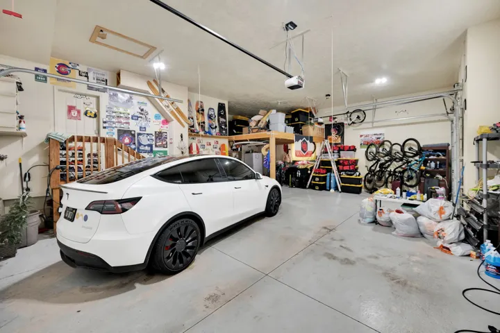 Garage featuring white fridge