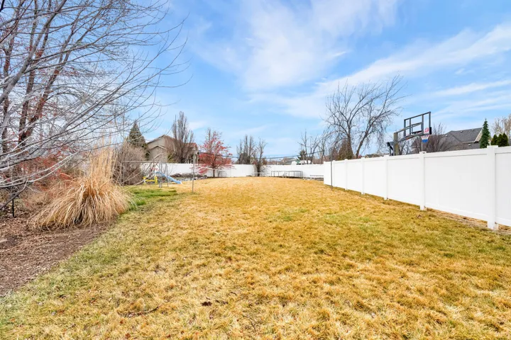 View of fenced backyard