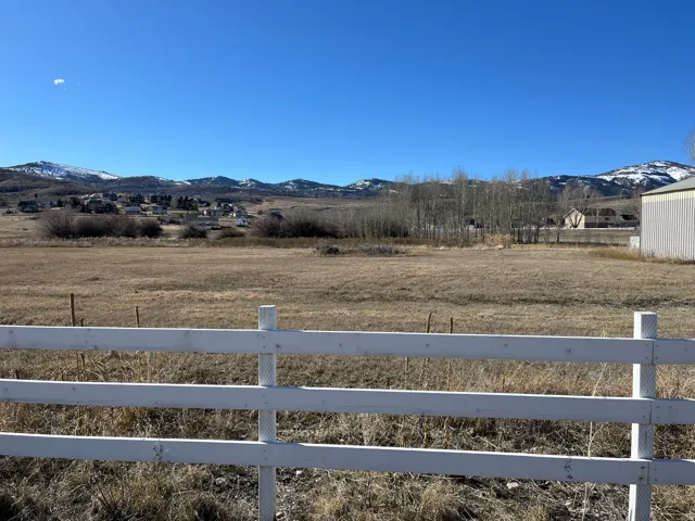 View of yard featuring a mountain view and a rural view