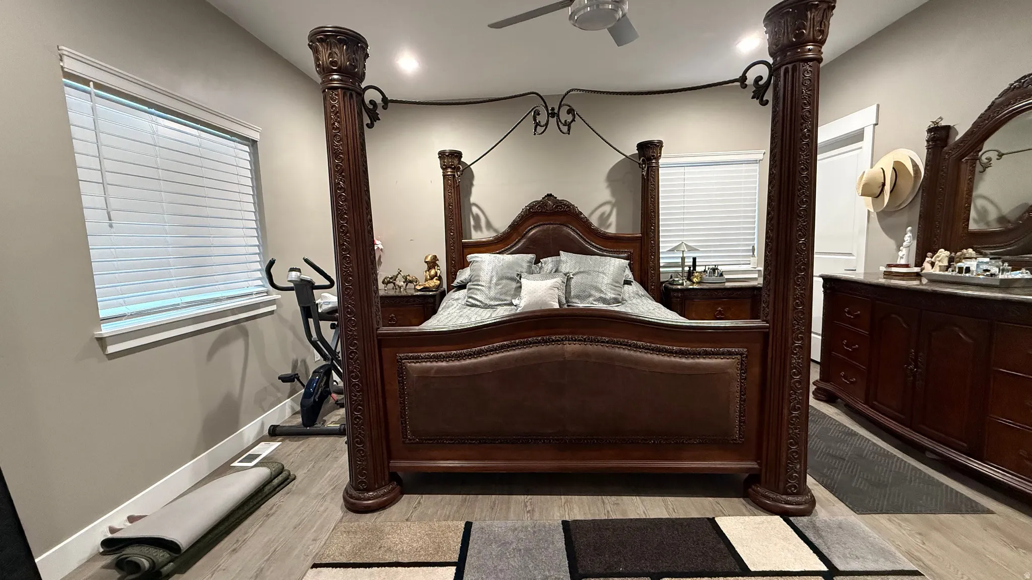 Bedroom with light wood finished floors and ceiling fan