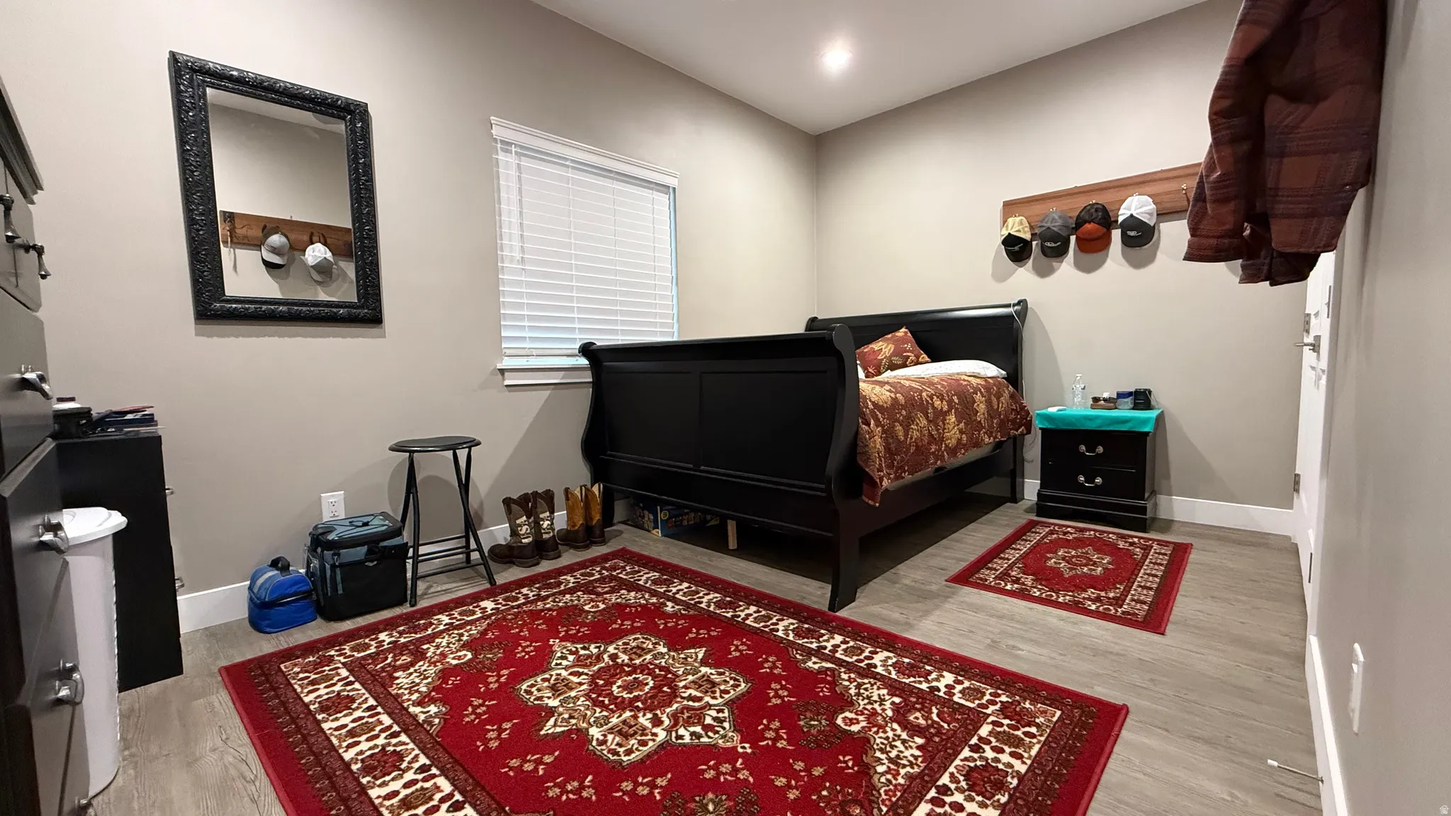 Bedroom with light wood finished floors and recessed lighting