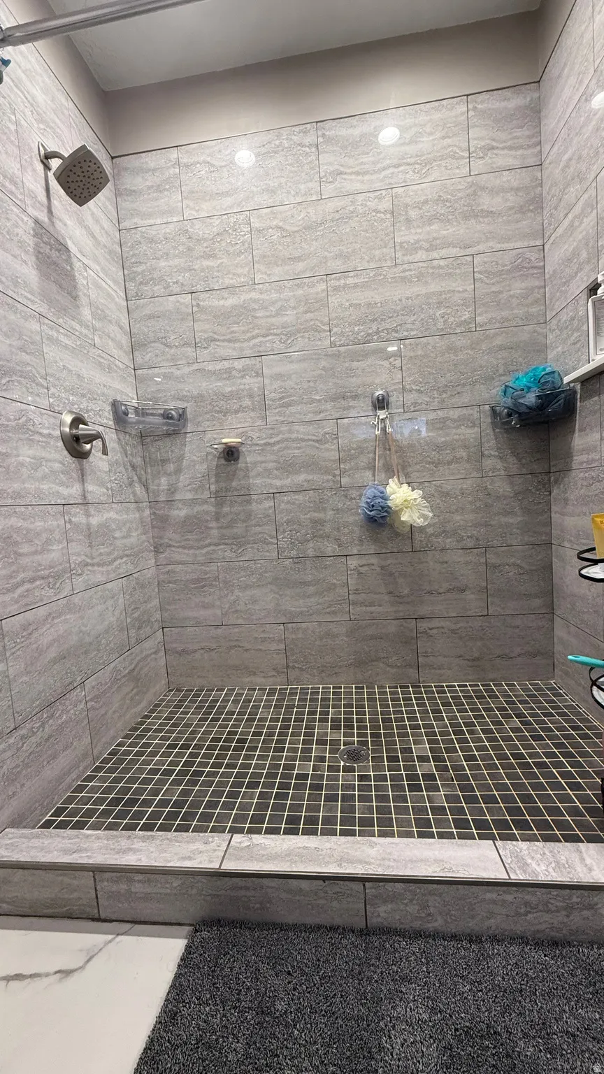 Full bath with a shower stall