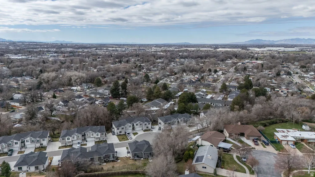 Aerial perspective of suburban area featuring a mountainous background