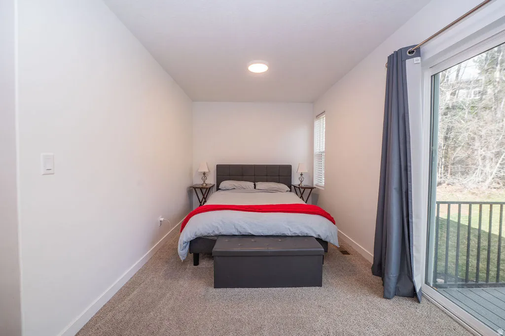 Carpeted bedroom with baseboards