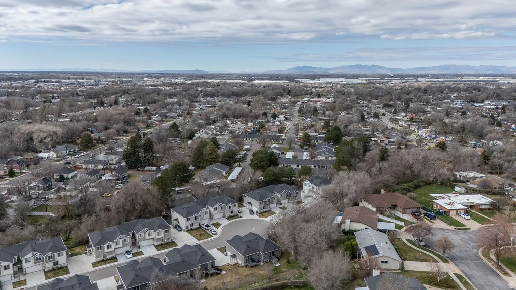 Aerial perspective of suburban area featuring a mountain backdrop
