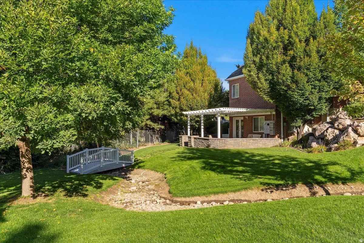 Fenced yard featuring a patio