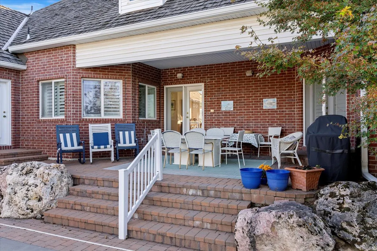 Deck with a grill and outdoor dining area