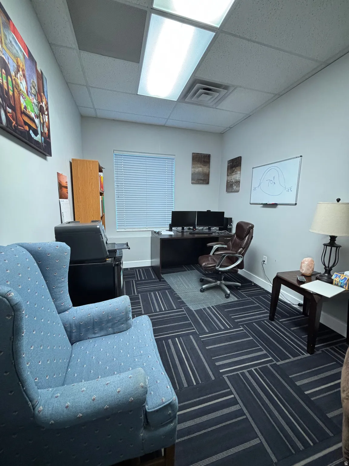 Office area featuring a paneled ceiling