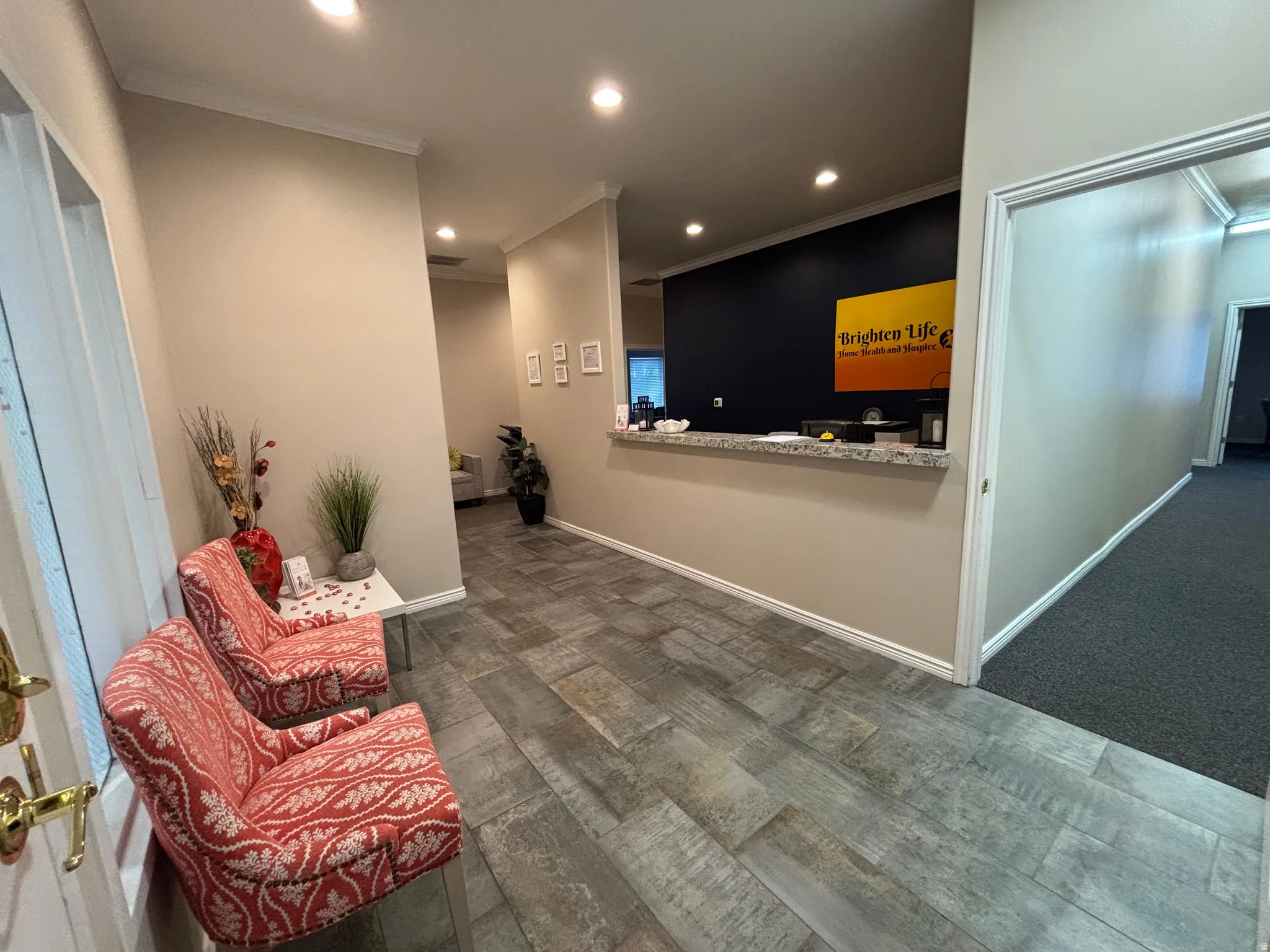 Reception with recessed lighting and ornamental molding