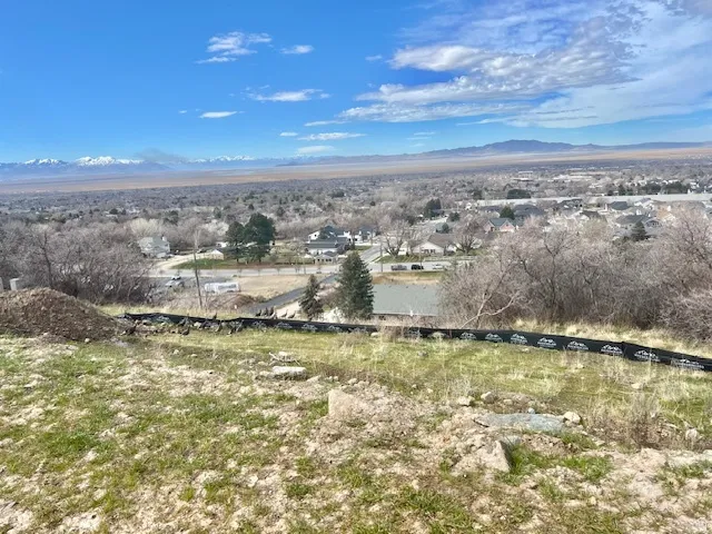 View of mountain backdrop with nearby suburban area