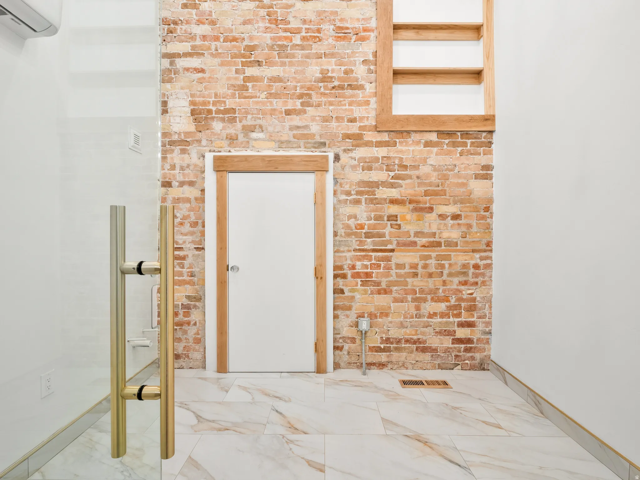 View of exterior entry featuring a mini split for heating / cooling