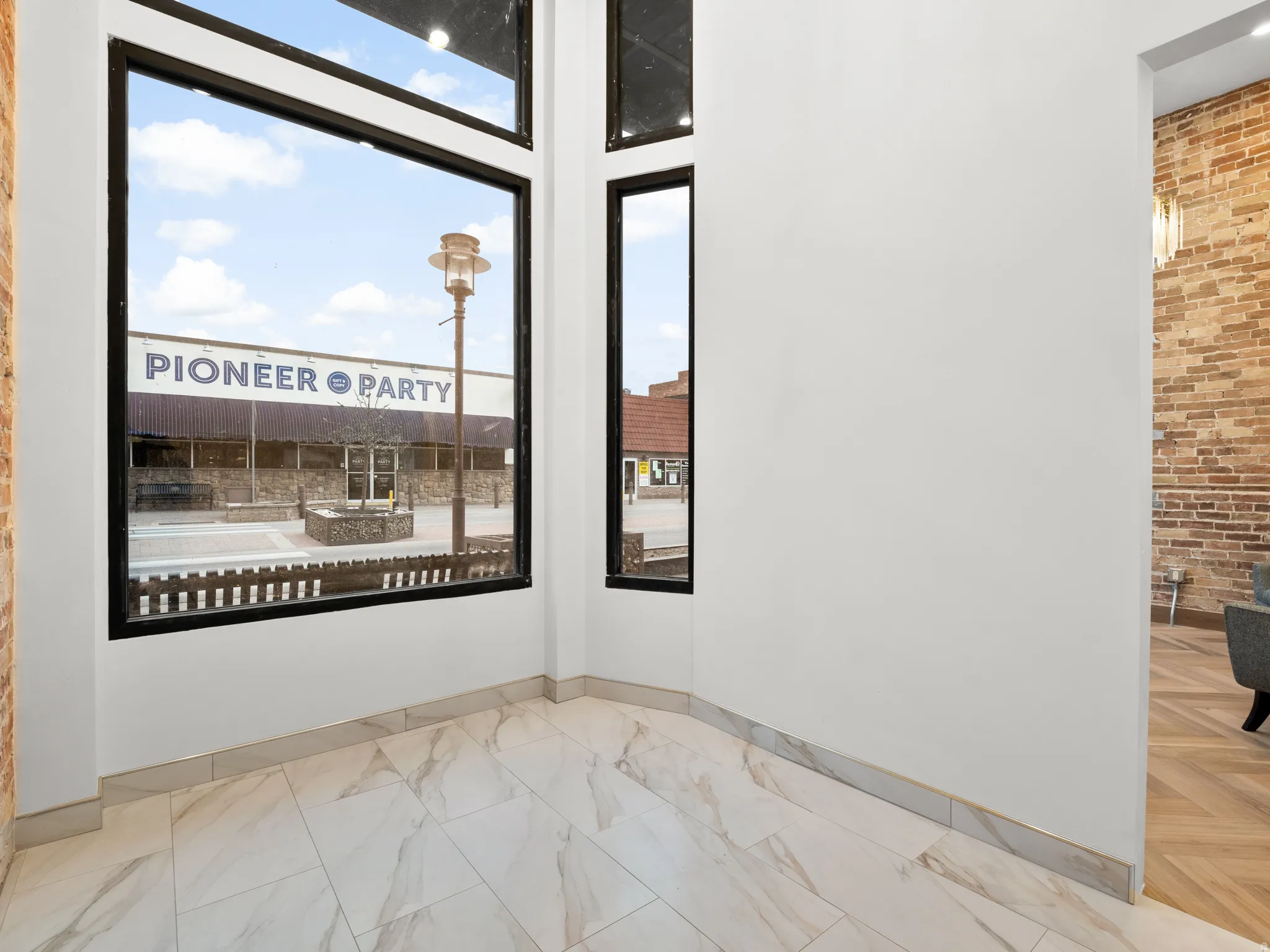 Spare room with brick wall