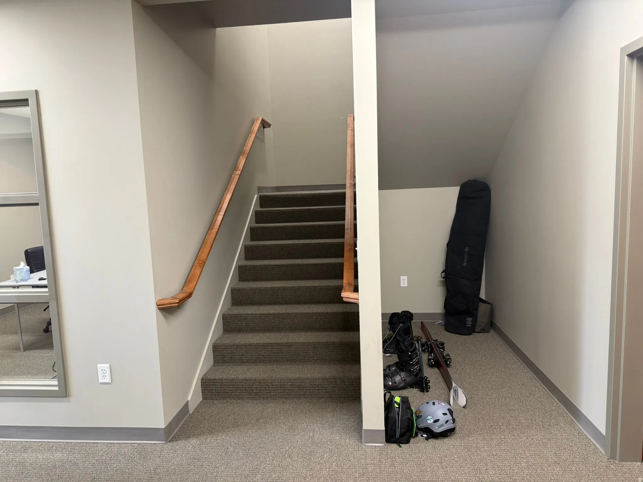 Stairway featuring carpet and baseboards