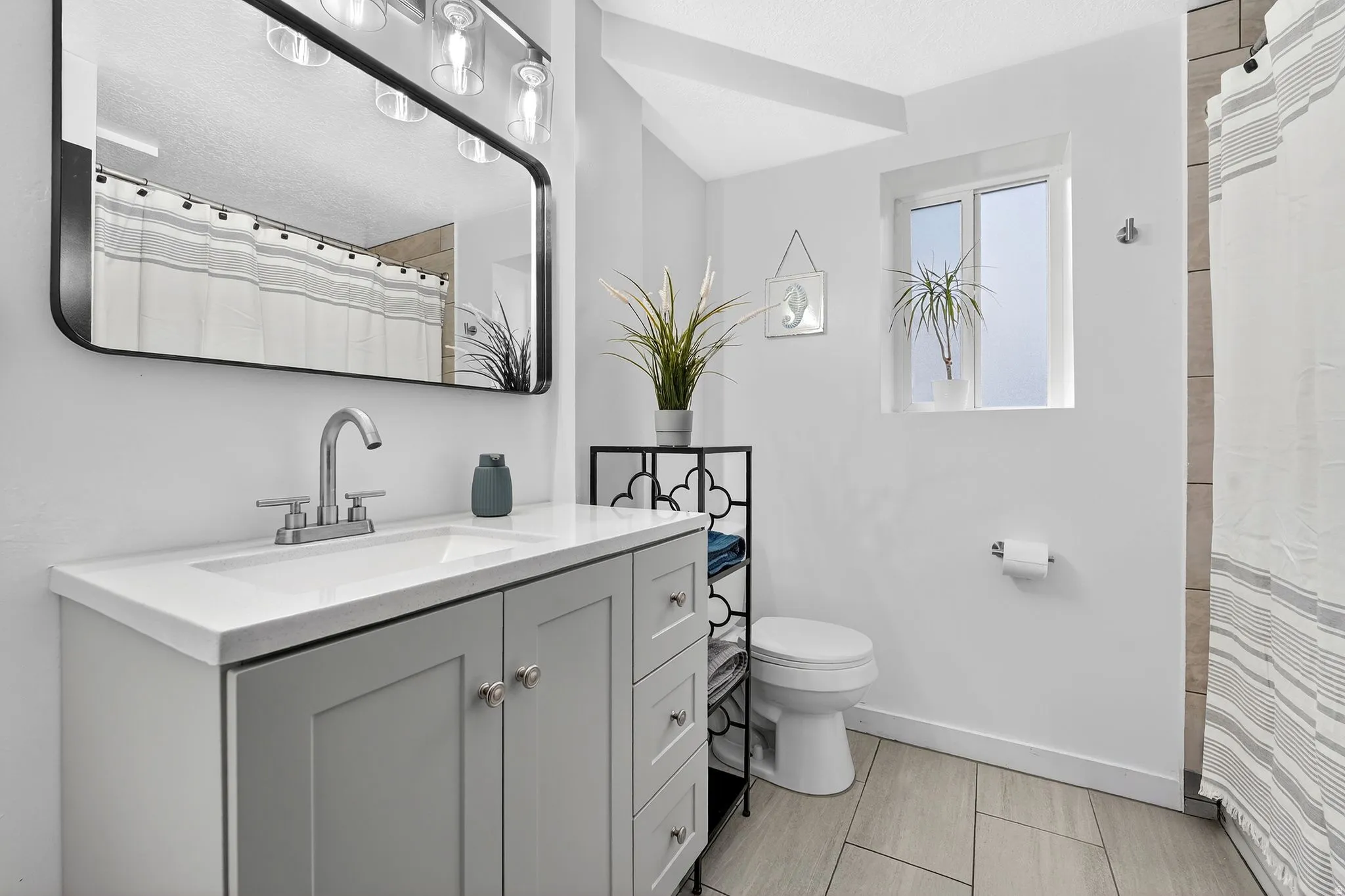 Bathroom with vanity and a shower with curtain