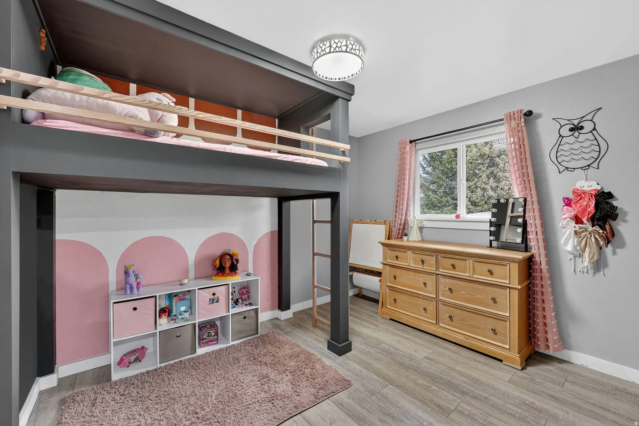 Bedroom featuring light wood-style flooring and baseboards
