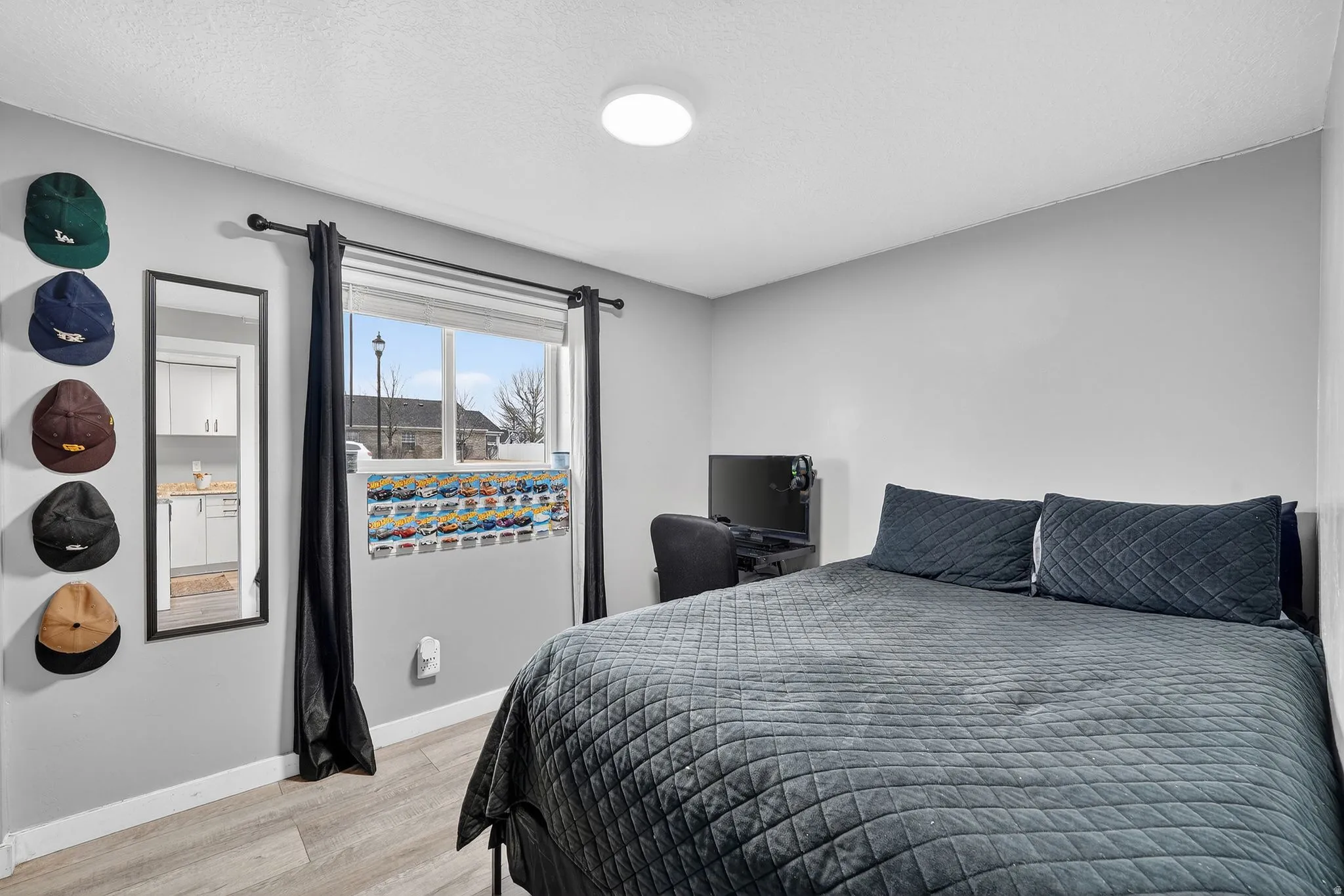 Bedroom featuring baseboards and light wood-style floors