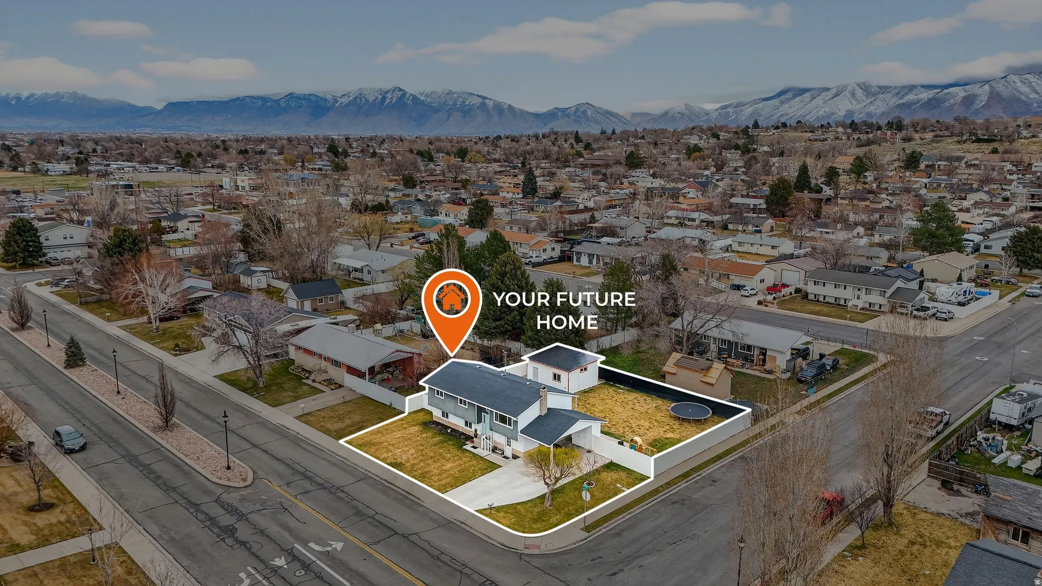Aerial view of residential area with a mountainous background