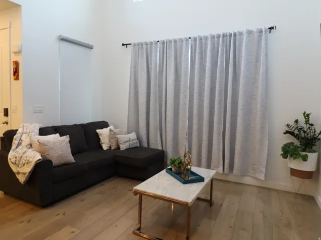 Living area with light wood-type flooring and baseboards