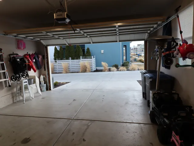 Garage featuring a garage door opener
