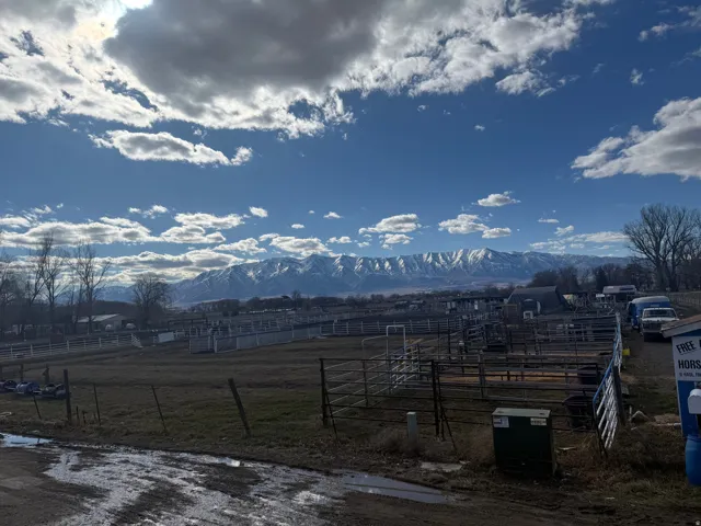 View of mountain backdrop featuring rural landscape