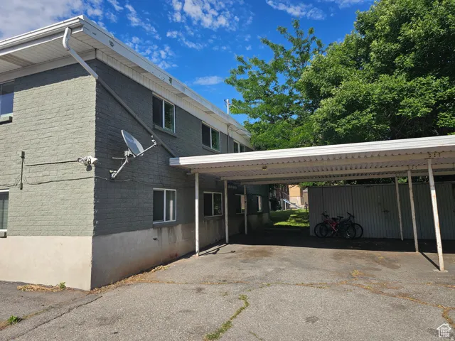View of property exterior with brick siding