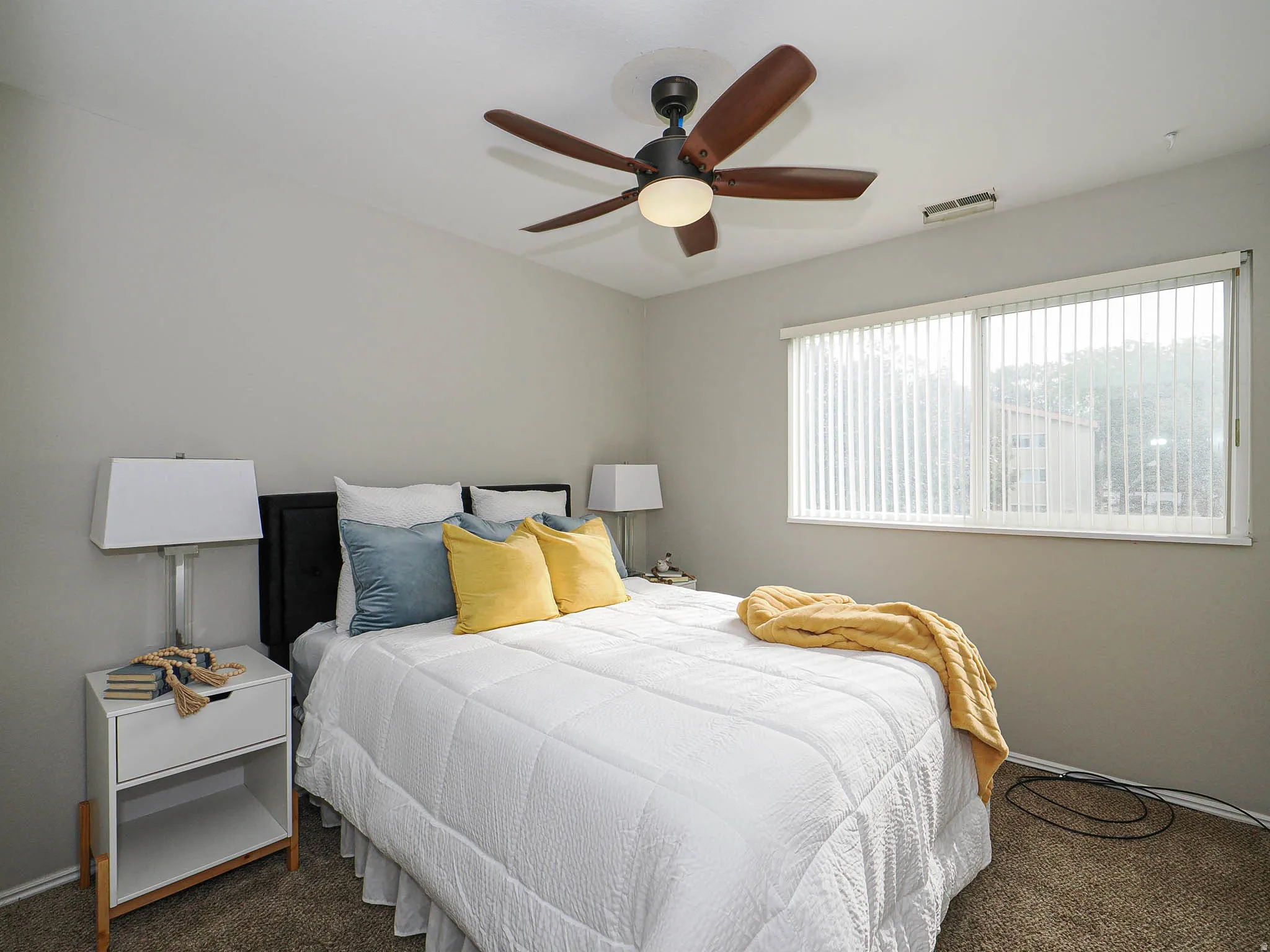 Bedroom featuring carpet flooring and ceiling fan