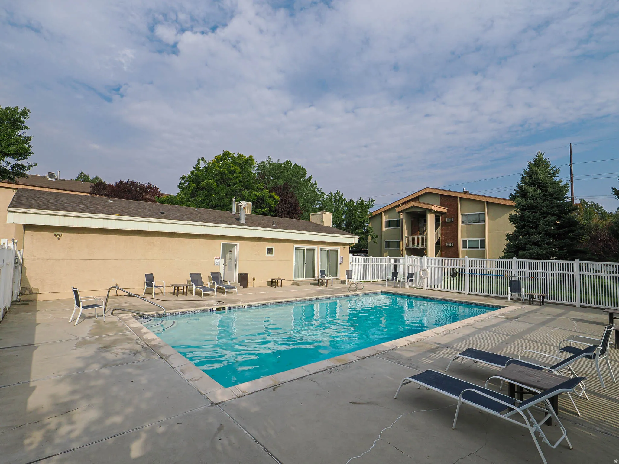 Community pool featuring a patio area