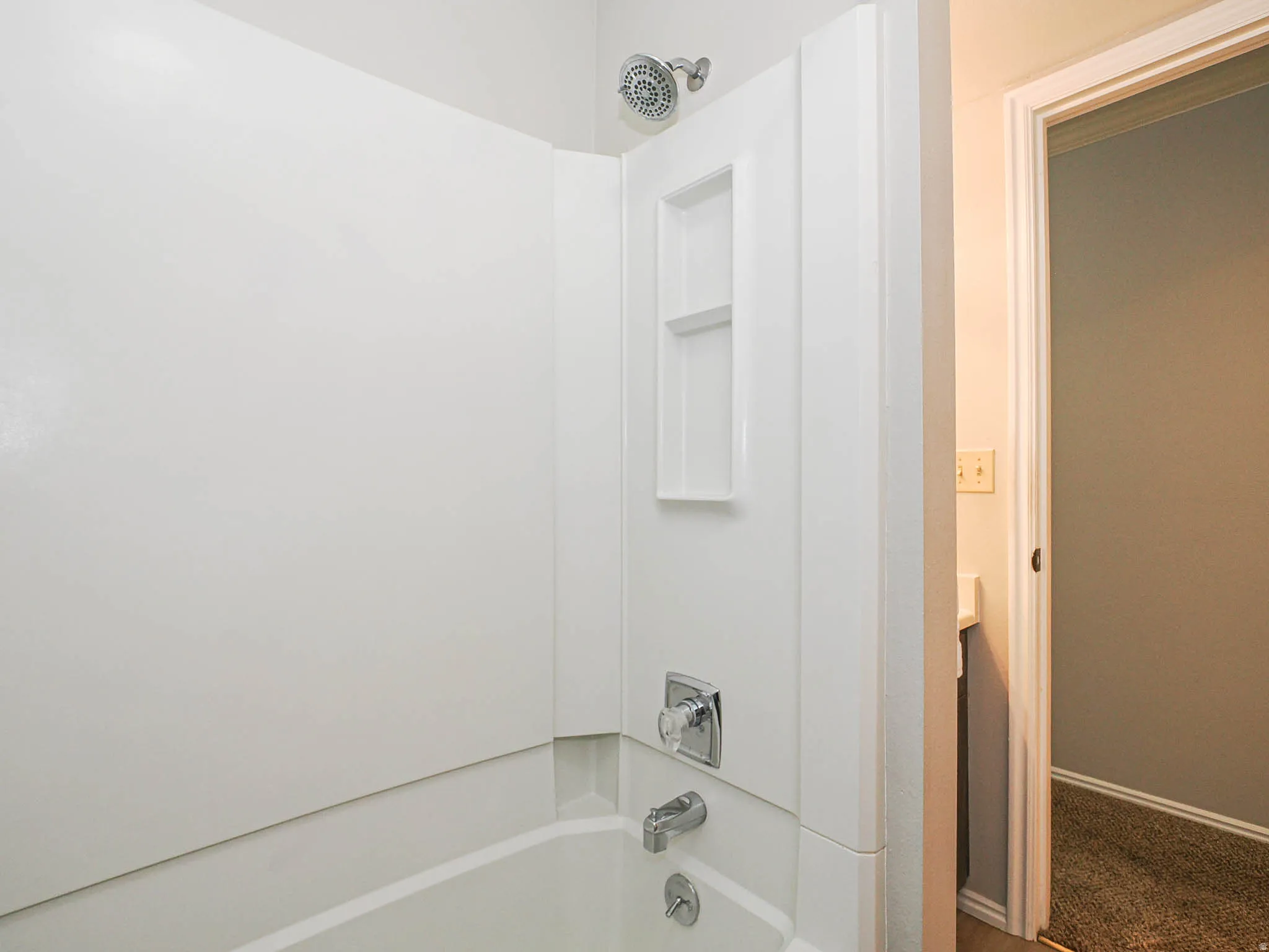 Bathroom with washtub / shower combination and vanity