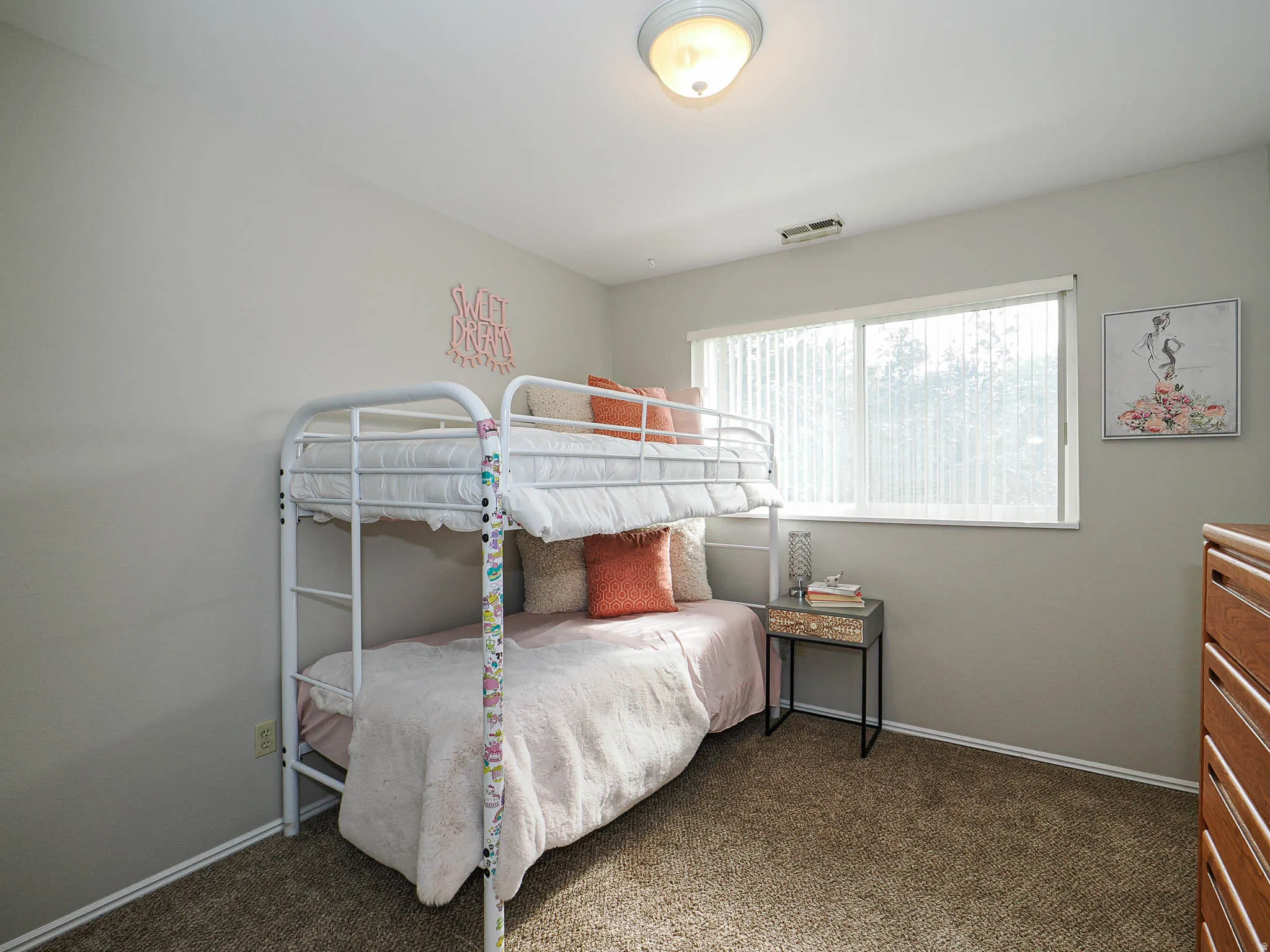 Bedroom with baseboards and dark carpet