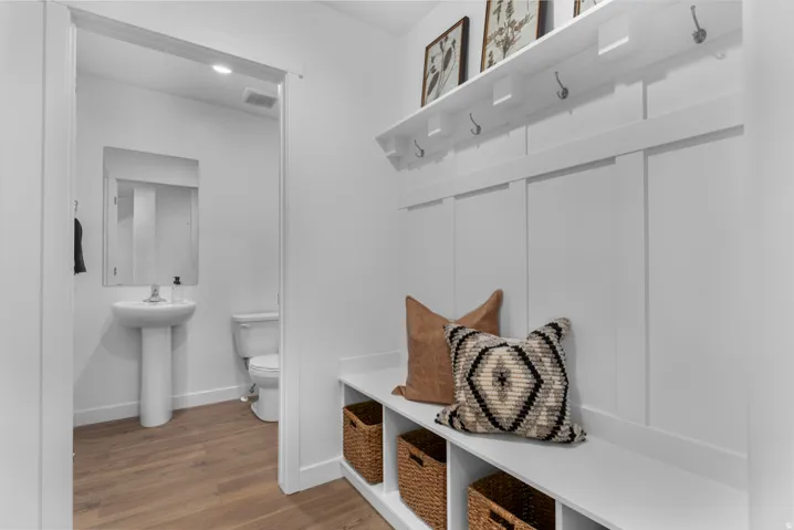 Mudroom with baseboards and wood finished floors
