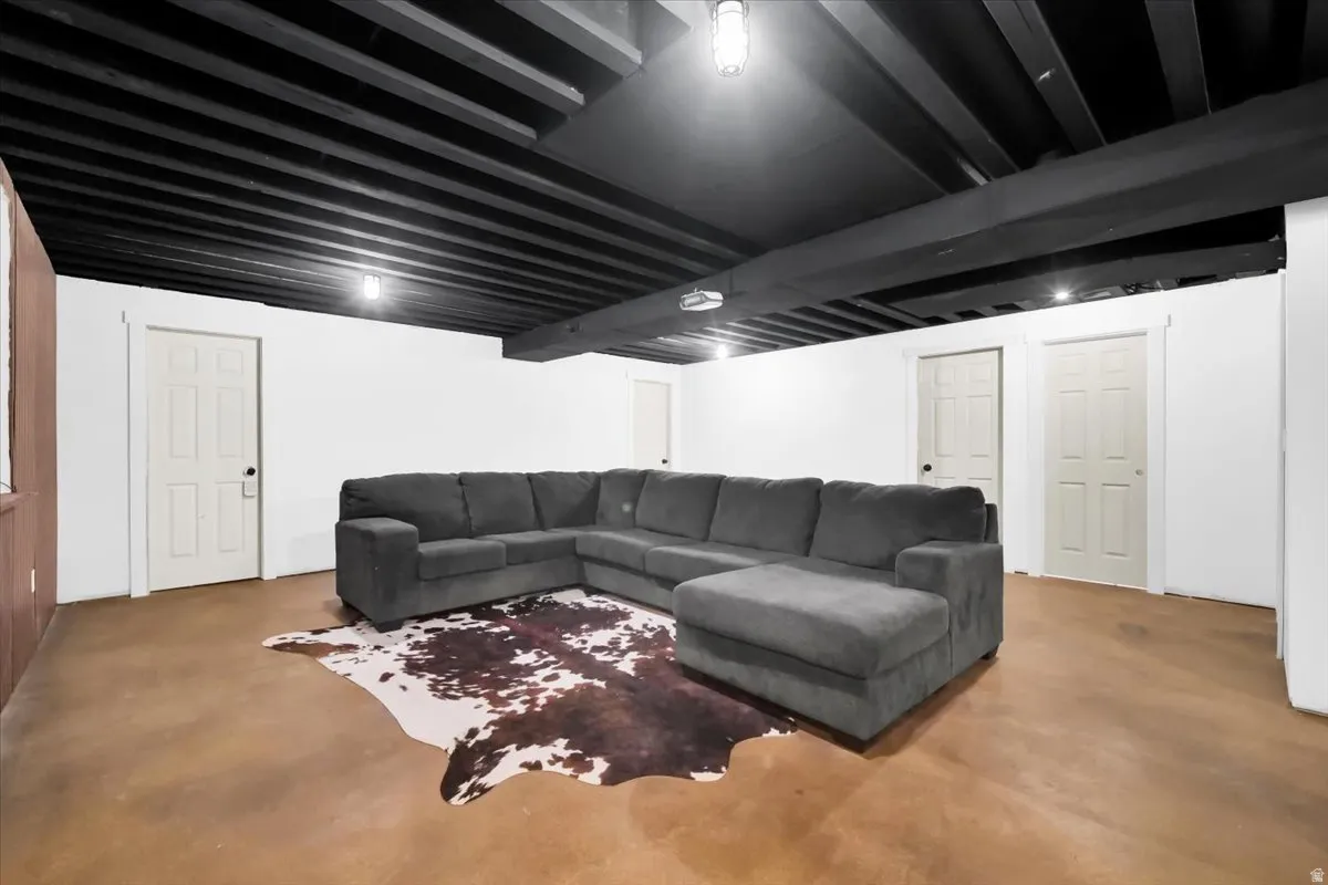 Living room featuring concrete flooring