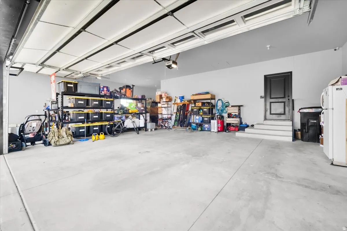 Garage with freestanding refrigerator